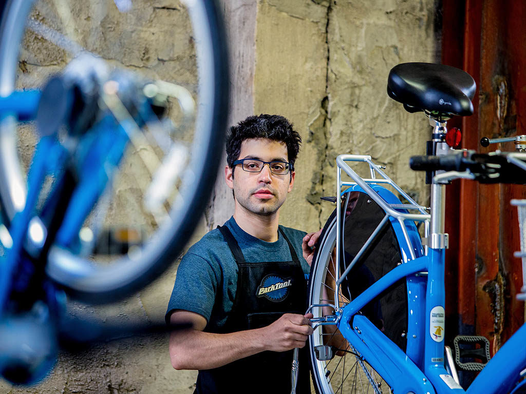 Jake Siemiarowski assembles bicycles at the Indego Bike Depot in Philadelphia, Pa., on April 15, 2015. ( JEFF FUSCO / Philadelphia Inquirer )